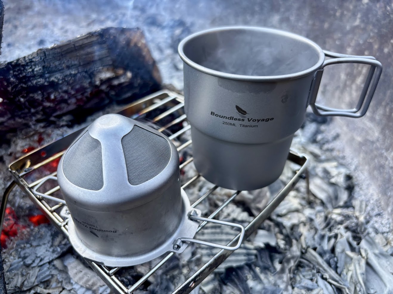 Boundless Voyage titanium coffee filter and titanium coffee mug 250ml over camp fire