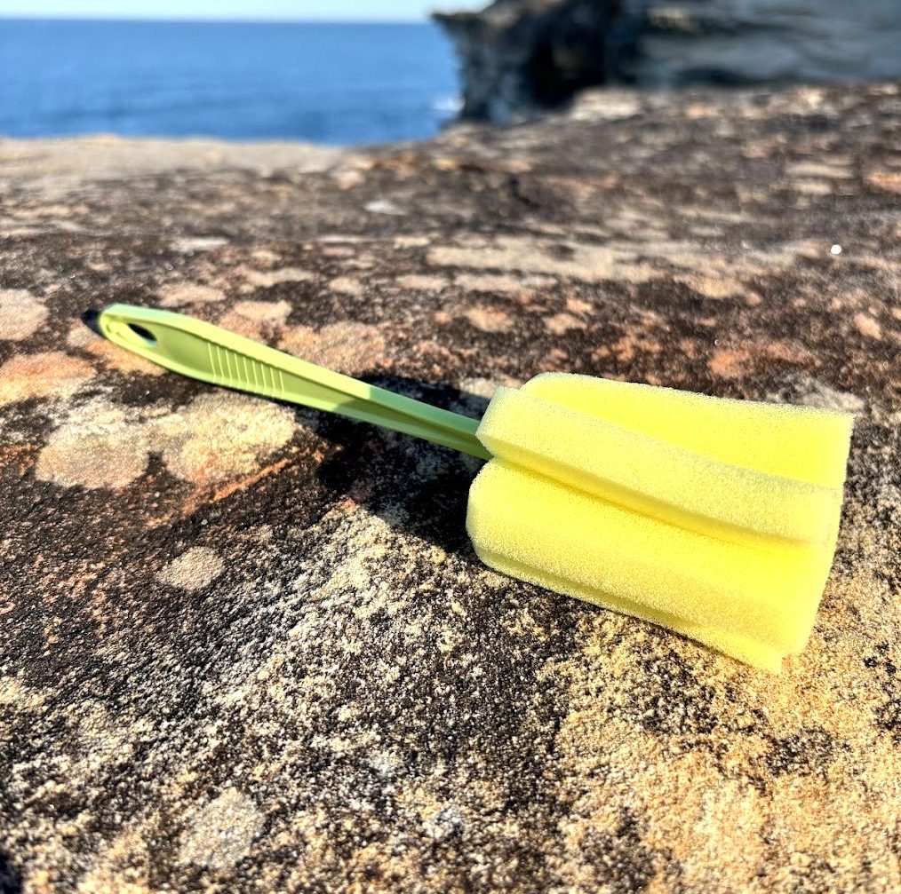 Cleaning brush for portable water storage for camping