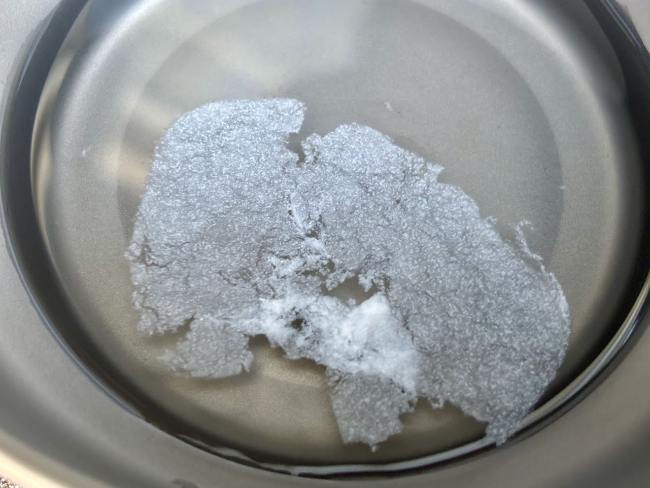 Dissolving the Sea to Summit pocket shampoo in a bowl of water