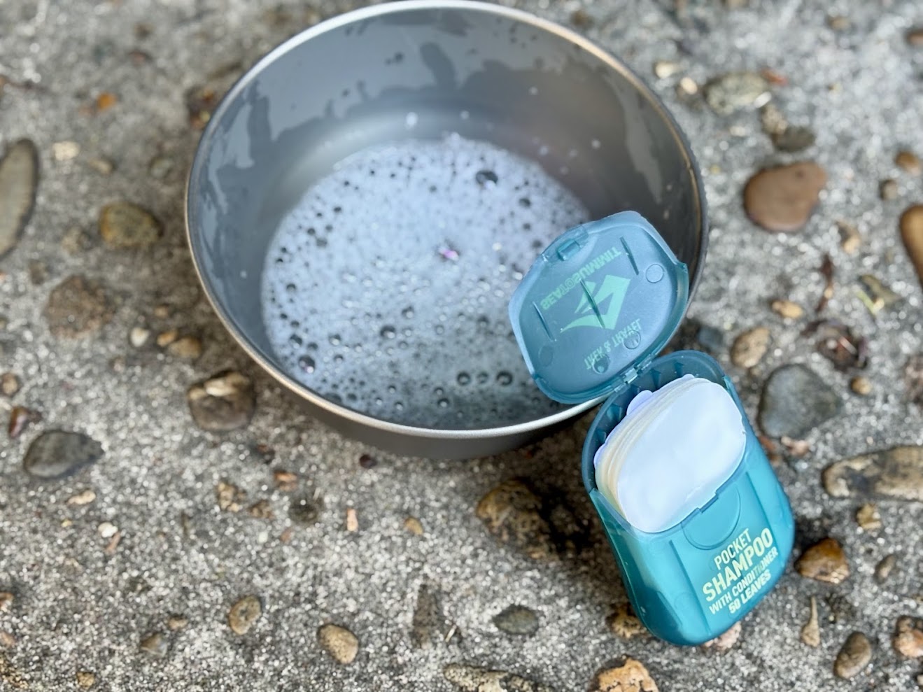 Dissolving two Sea to Summit pocket shampoo leaves in a bowl of water gives the right amount of soap