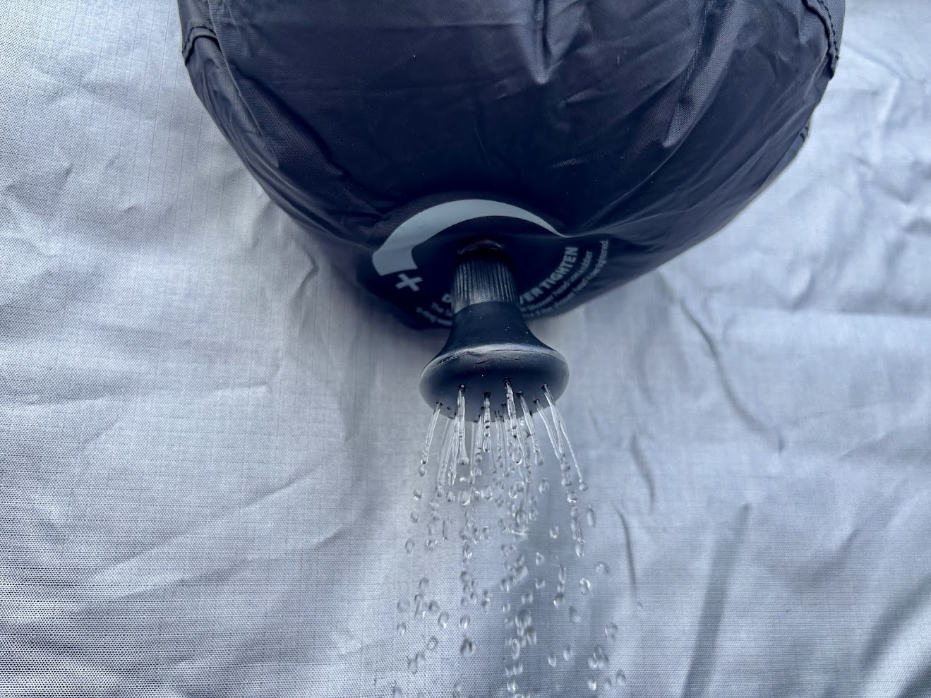 Water from nozzle of the Sea to Summit Pocket Shower