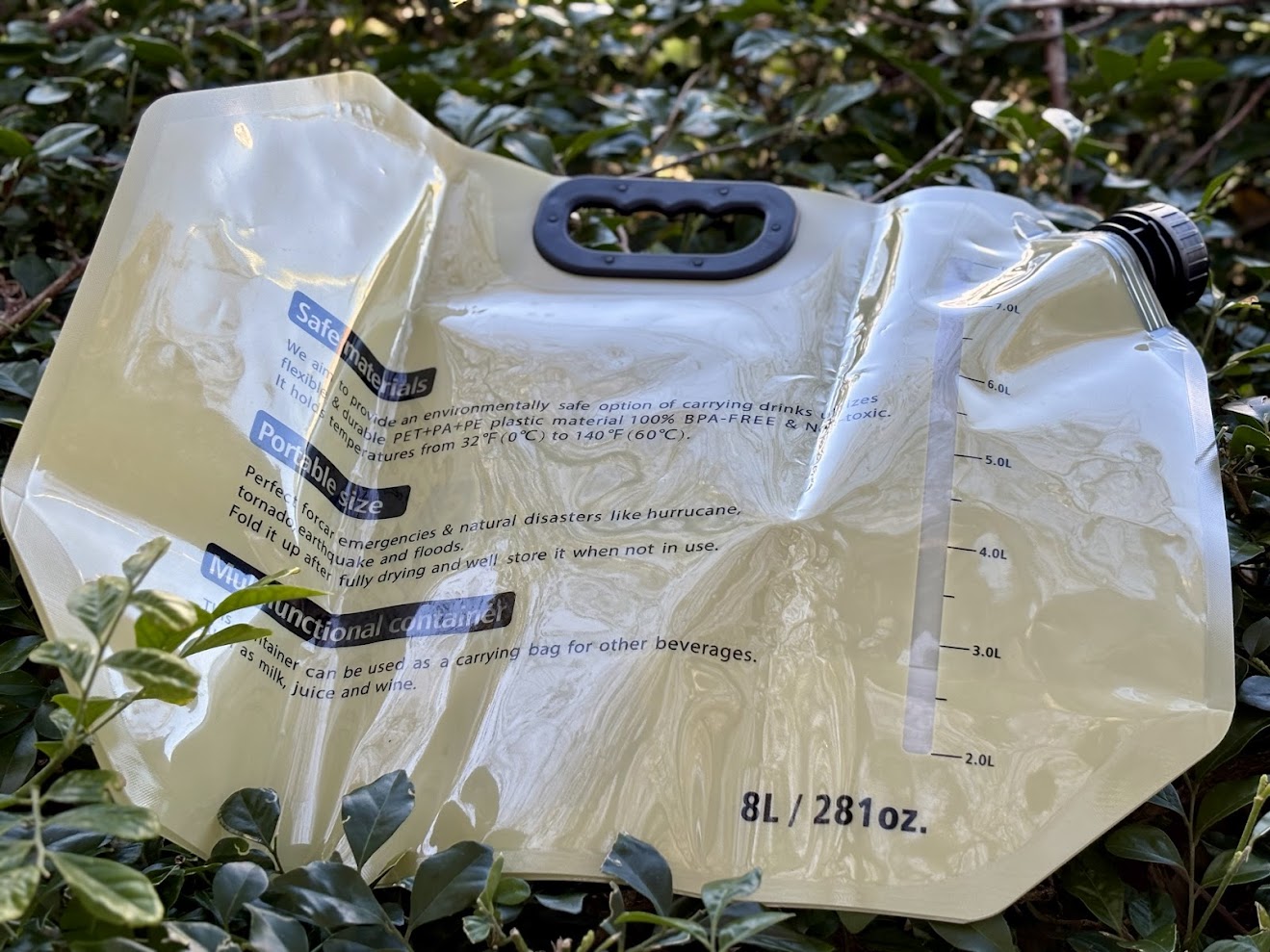 Backside of unfolded 8L camping water bag​ incl measuring scale