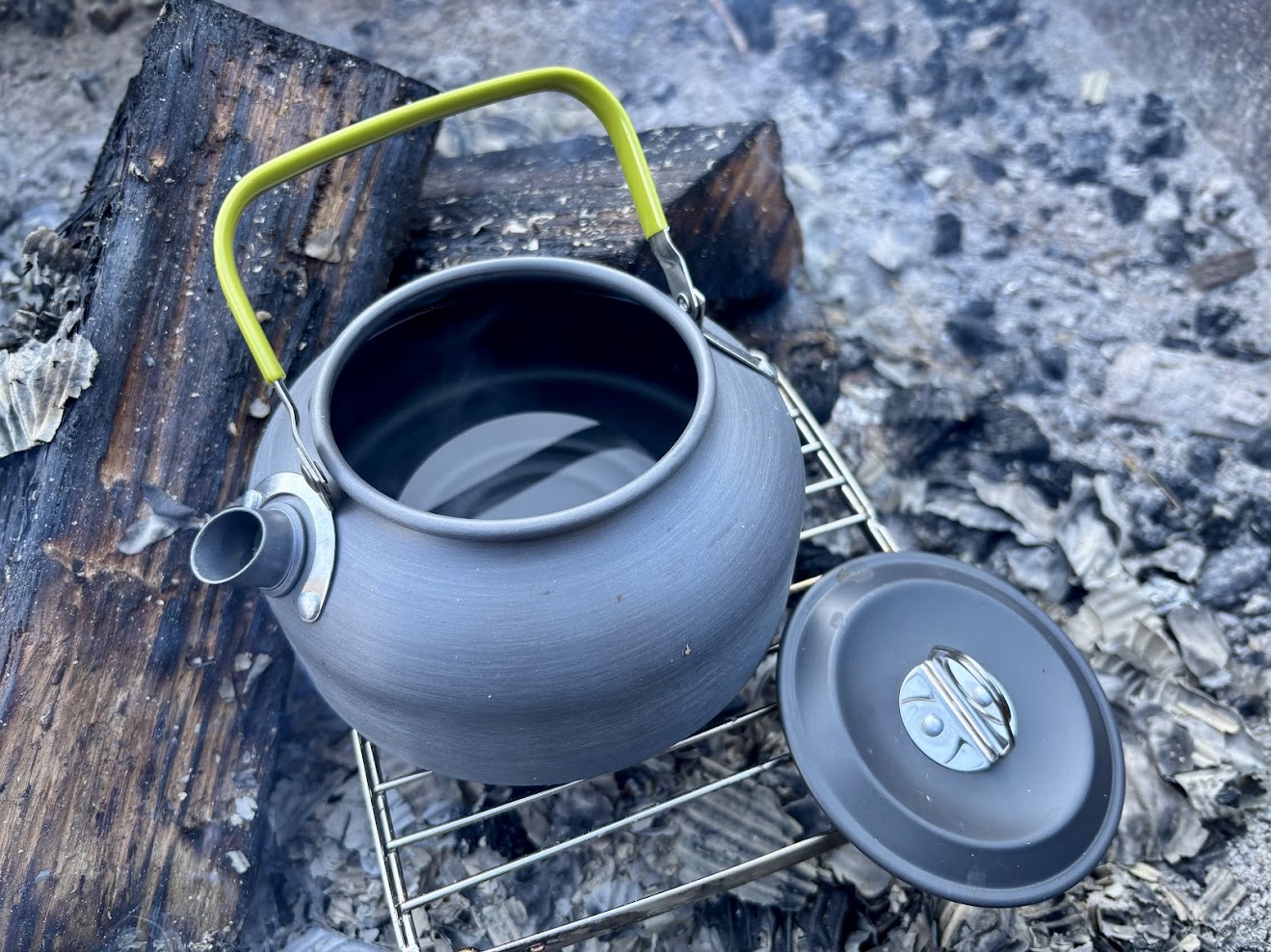 Boiling water over open fire with the aluminum camp kettle