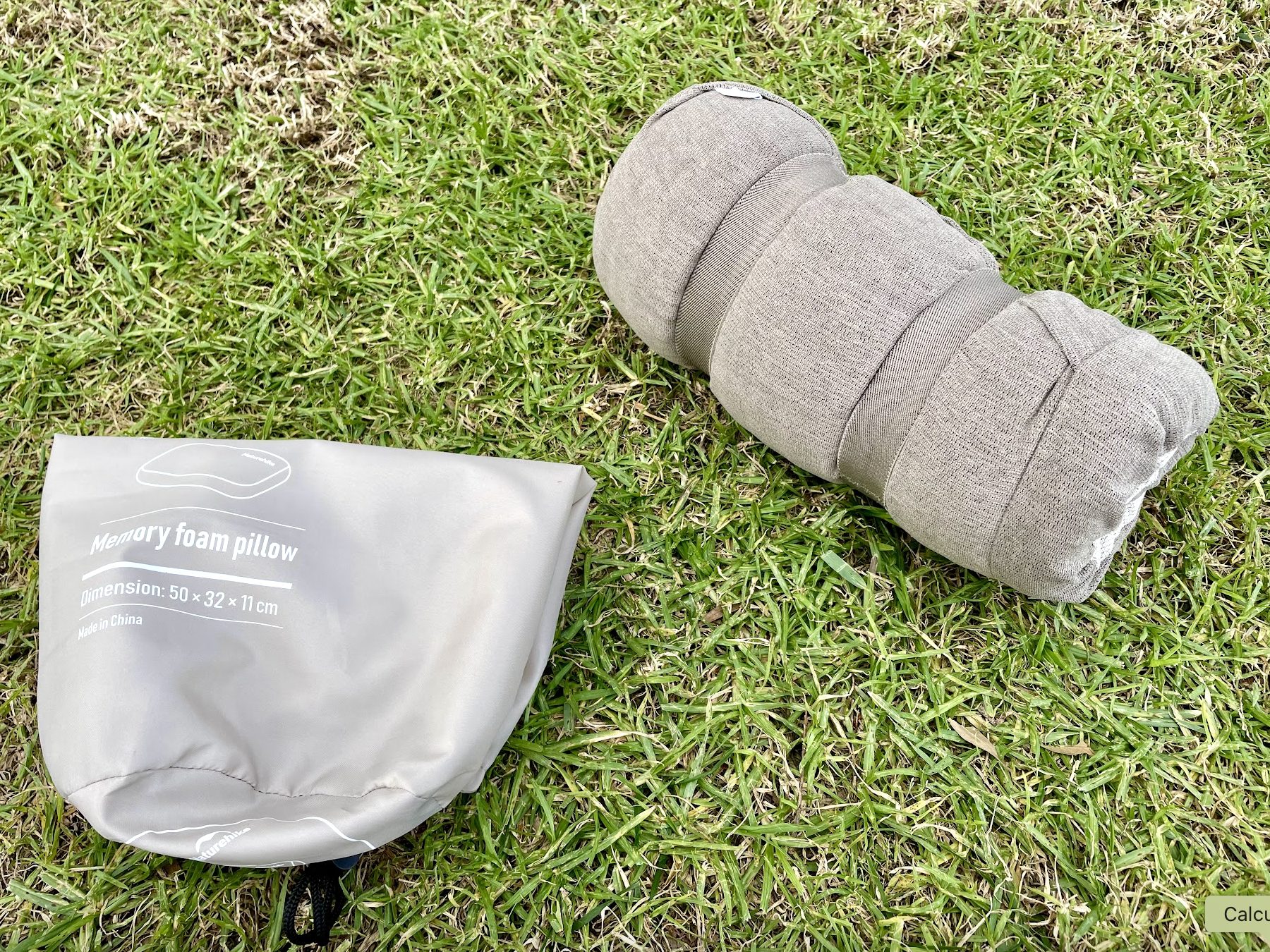 Naturehike travel memory foam pillow unpacked and folded with straps