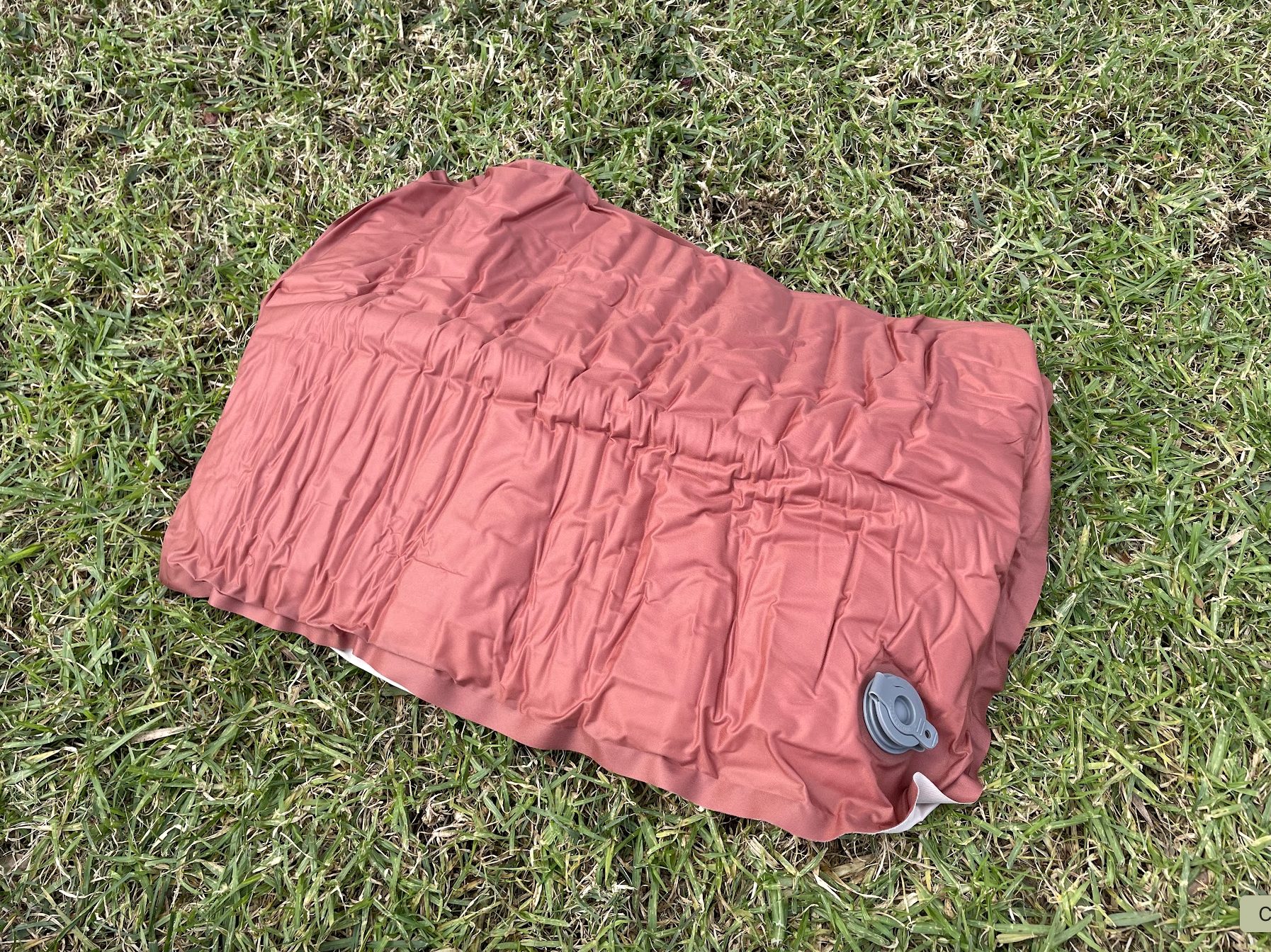 Uninflated Naturehike inflatable travel pillow​ in Almond colour