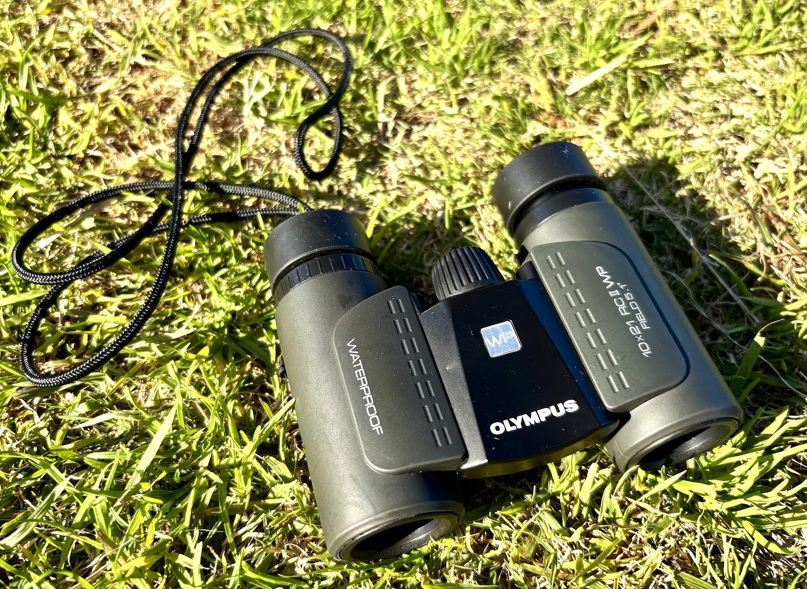 The body of the Olympus 10x21 RC II binoculars uses a rubber-armoured exterior model