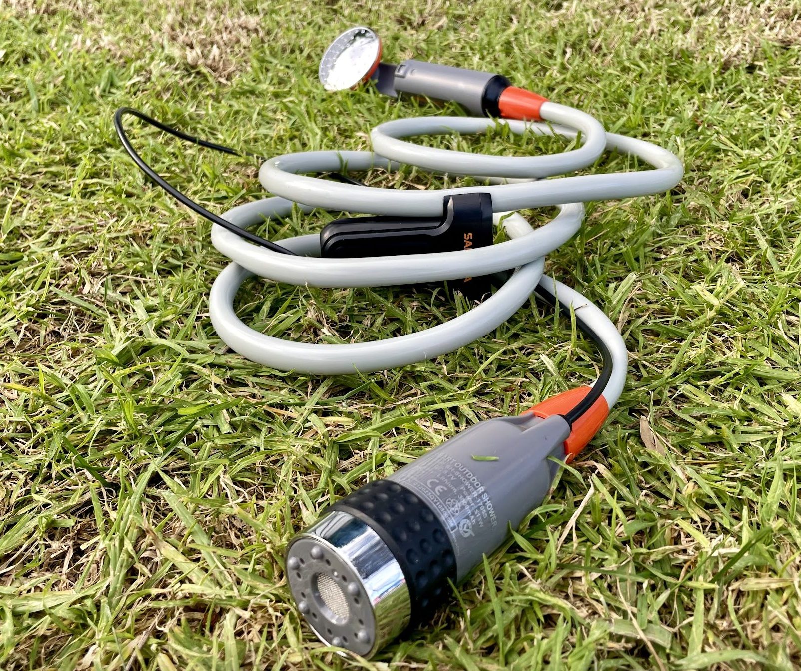 San Hima portable camping shower assembled in grass