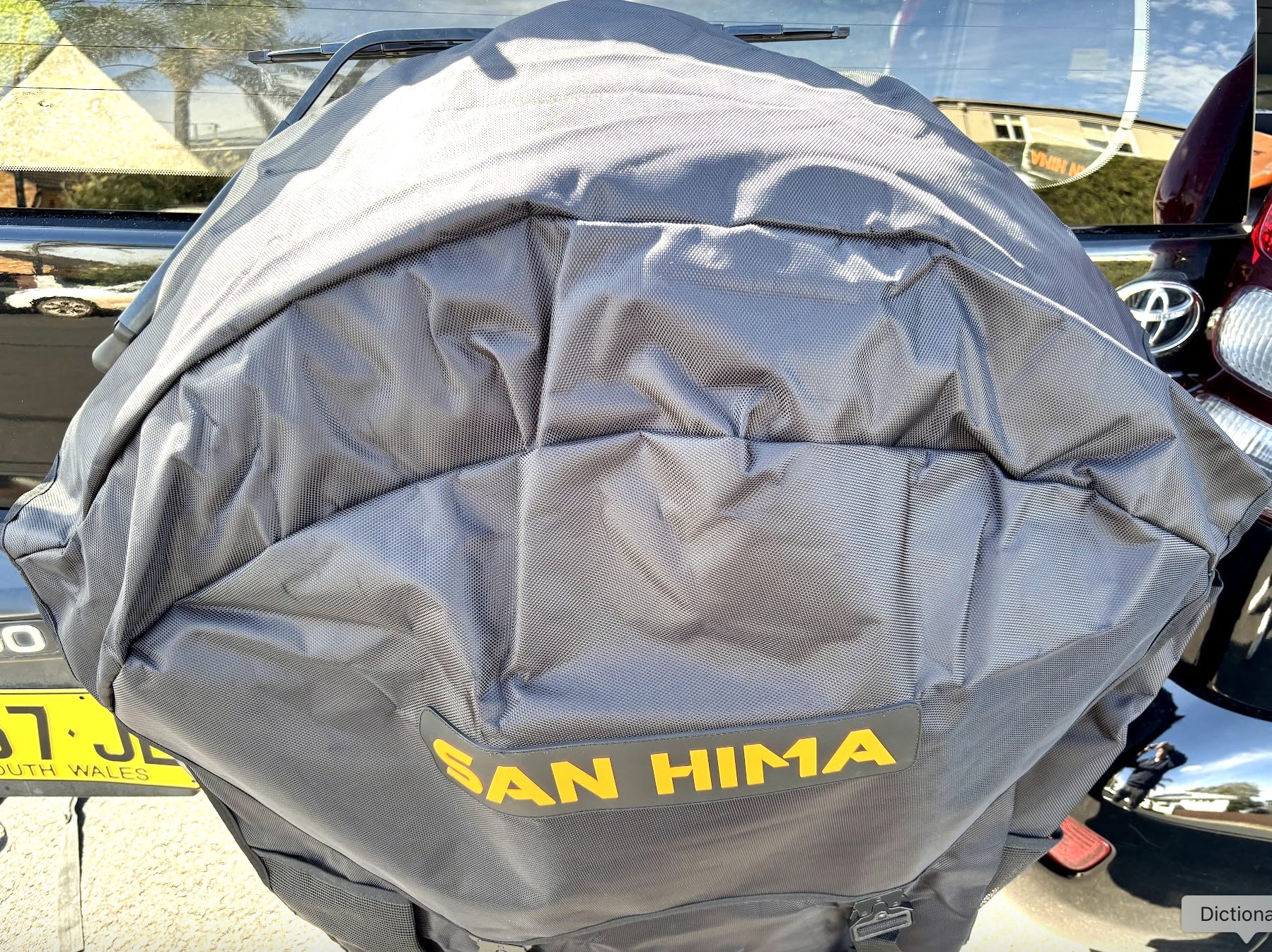 San Hima spare wheel gear bag mounted on back of the Prado