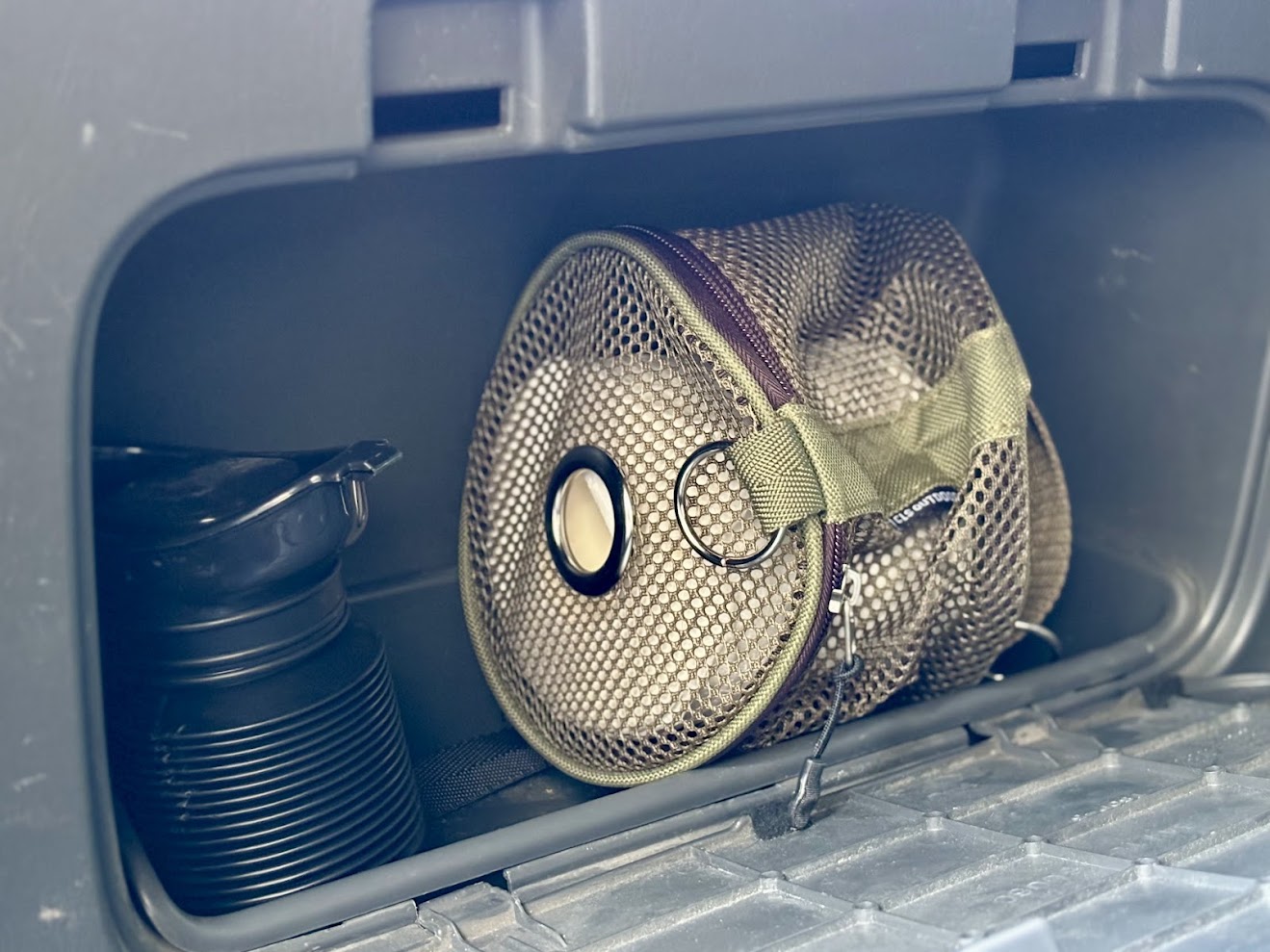 Storing my portable urinal​ and mesh toilet paper holder in side pocket of Prado