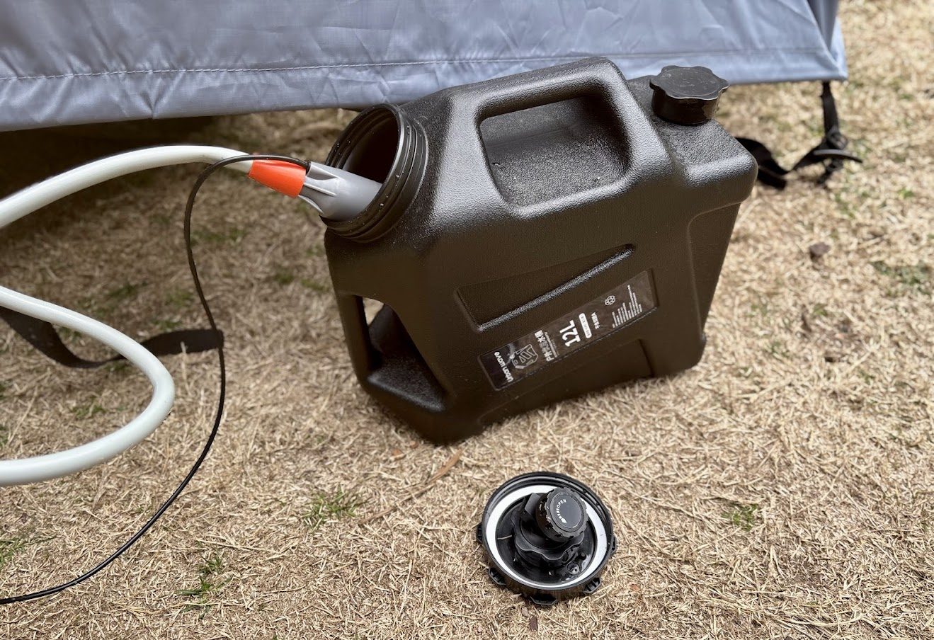 Using a 12L water container as watter supply for the San Hima camp shower