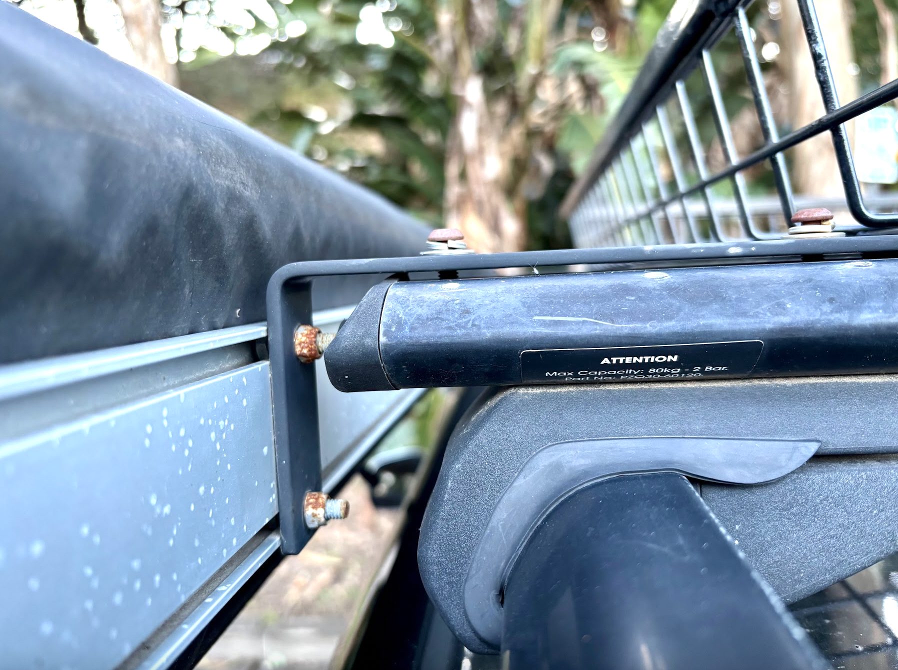 The XTM car awning comes with L-shaped mounting brackets that mount onto any roof platform or cross bars