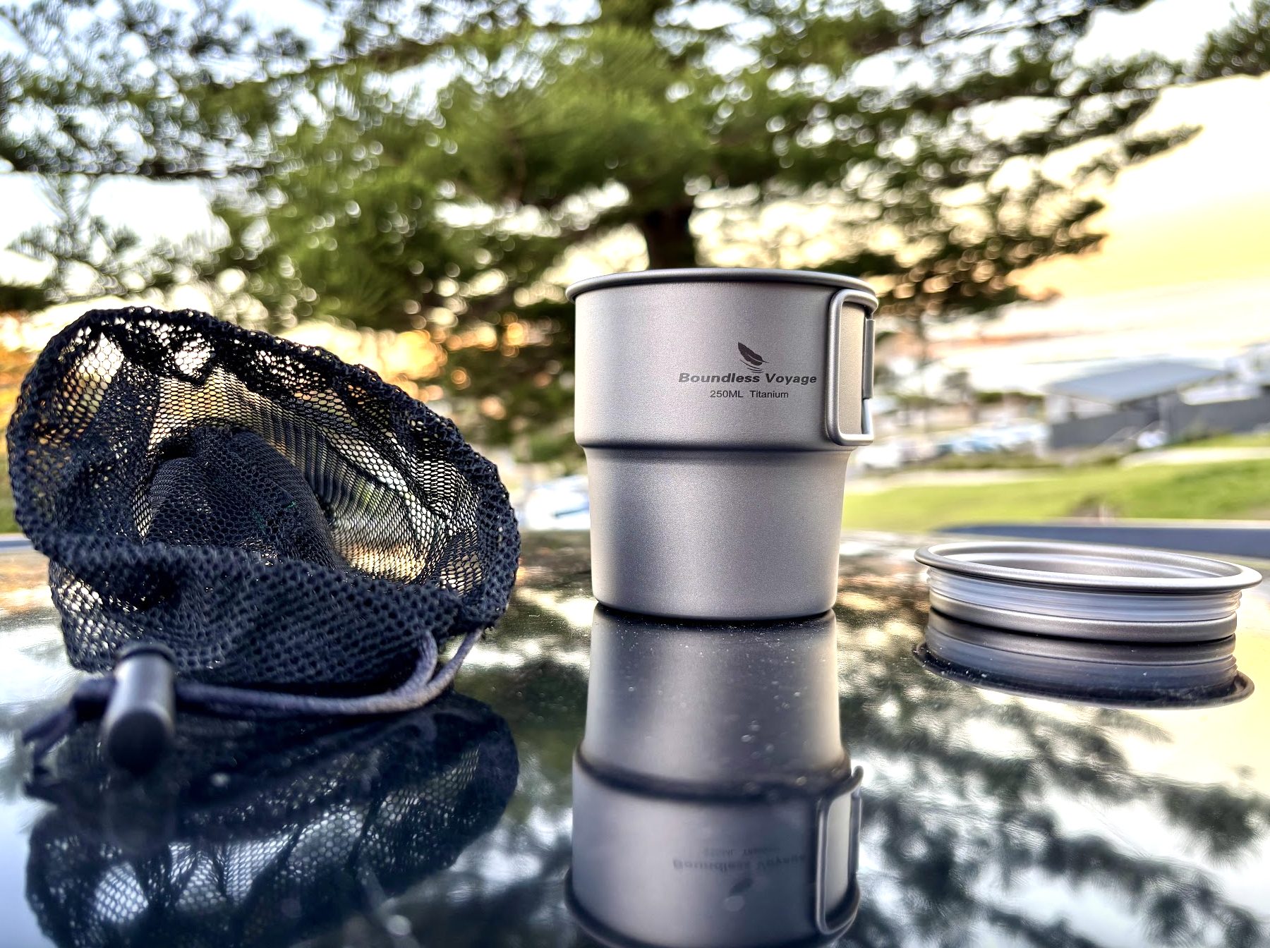 Boundless Voyage titanium camp coffee cup with mesh storage bag