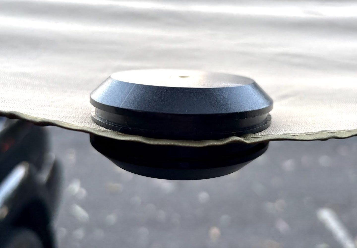 I found these magnetic camping hooks most effective when placed on steel poles, a car door frame, or attach them to our XTM awning