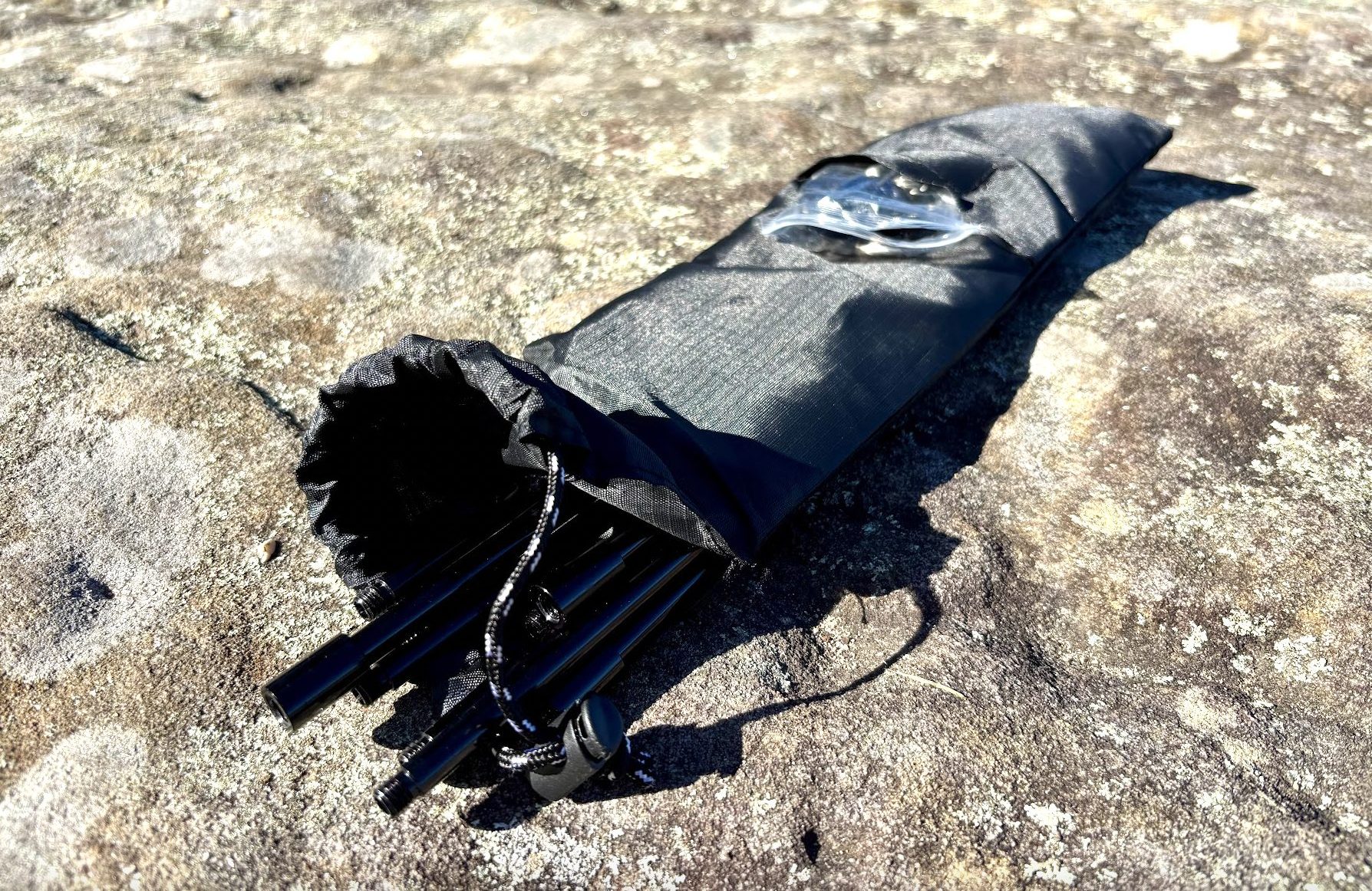 Compact camp fire tripod in carry pouch