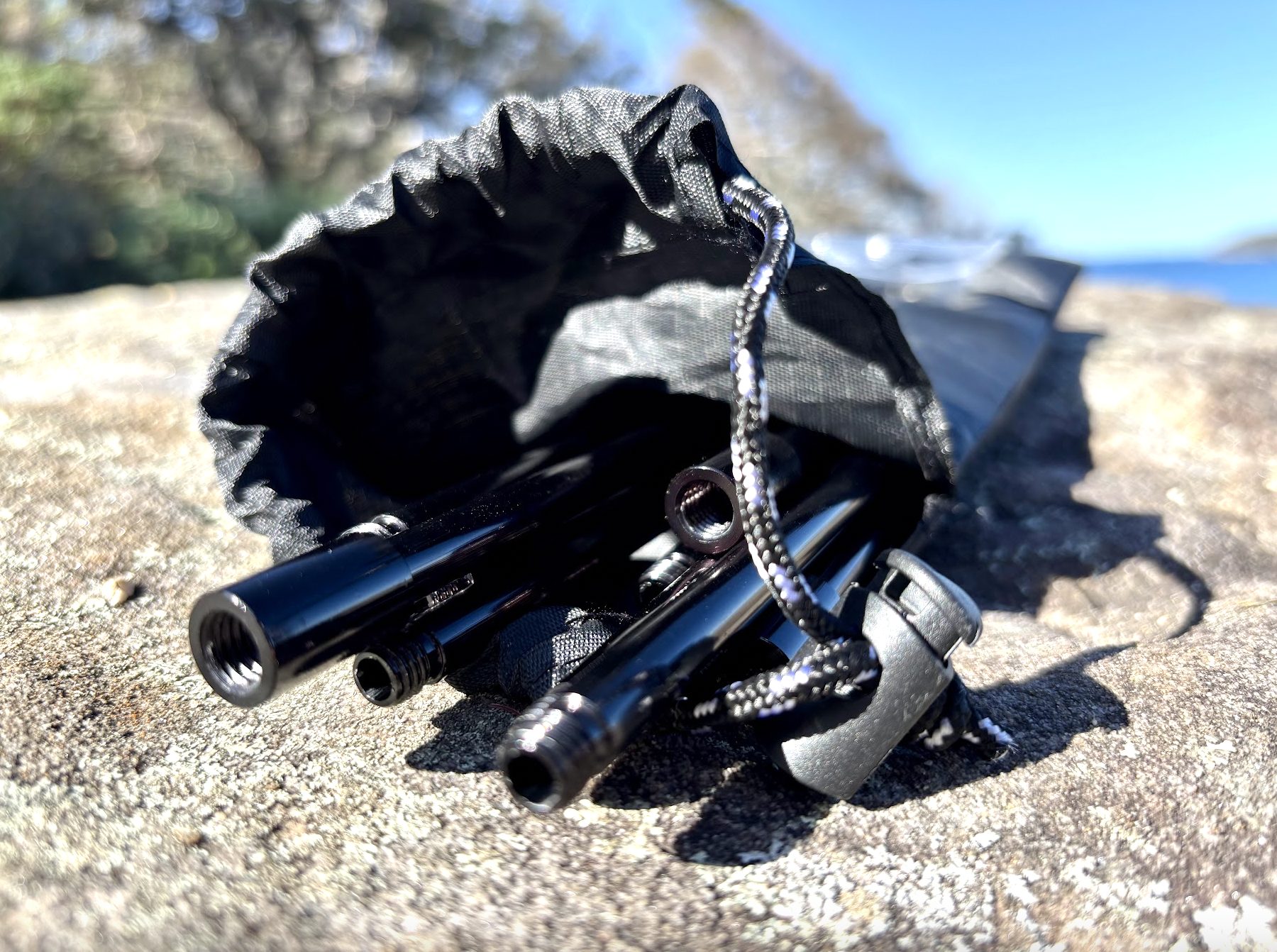Black aluminium legs of camp fire tripod