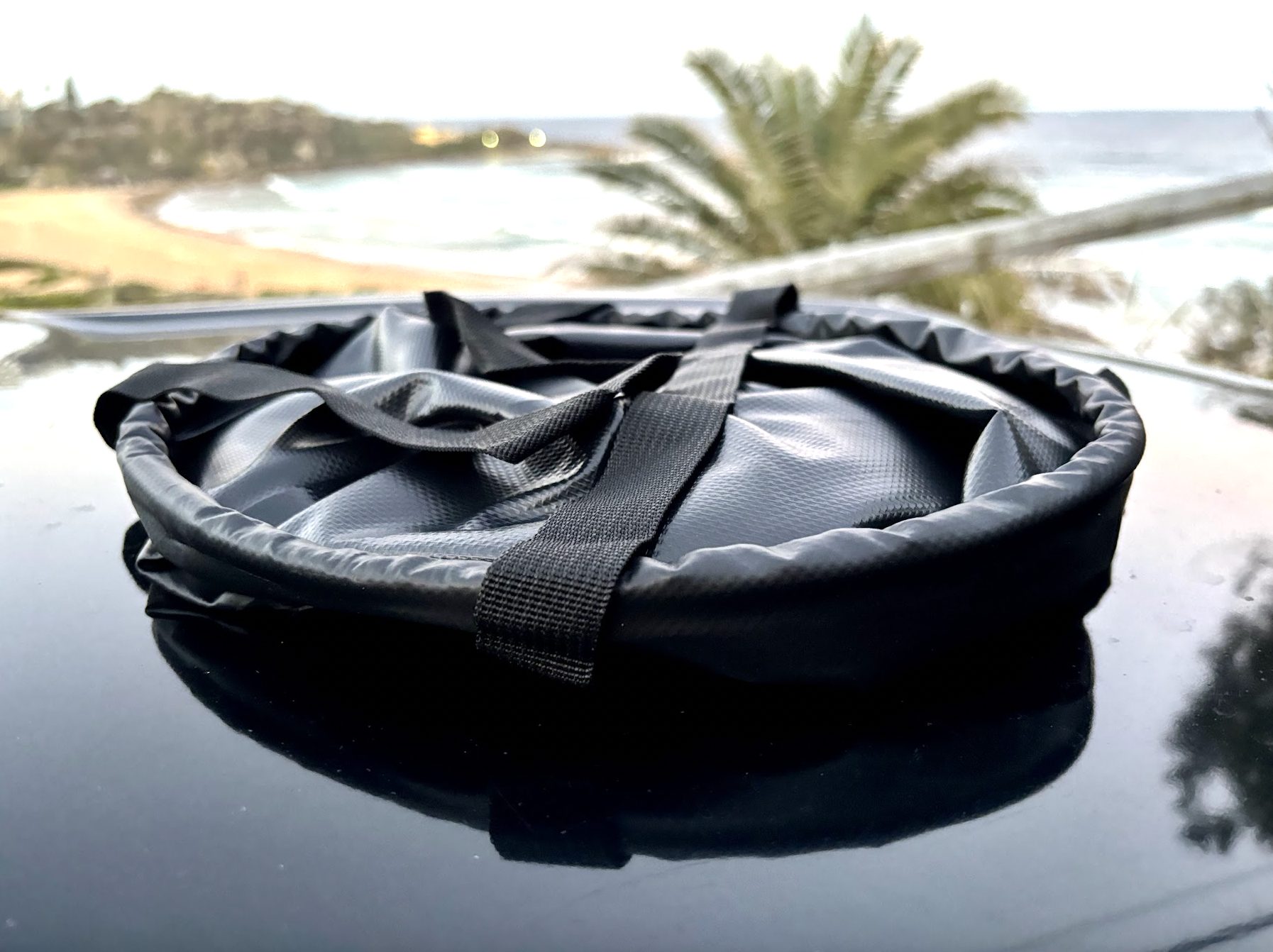 Collapsed 20L folding bucket on 4WD bonnet