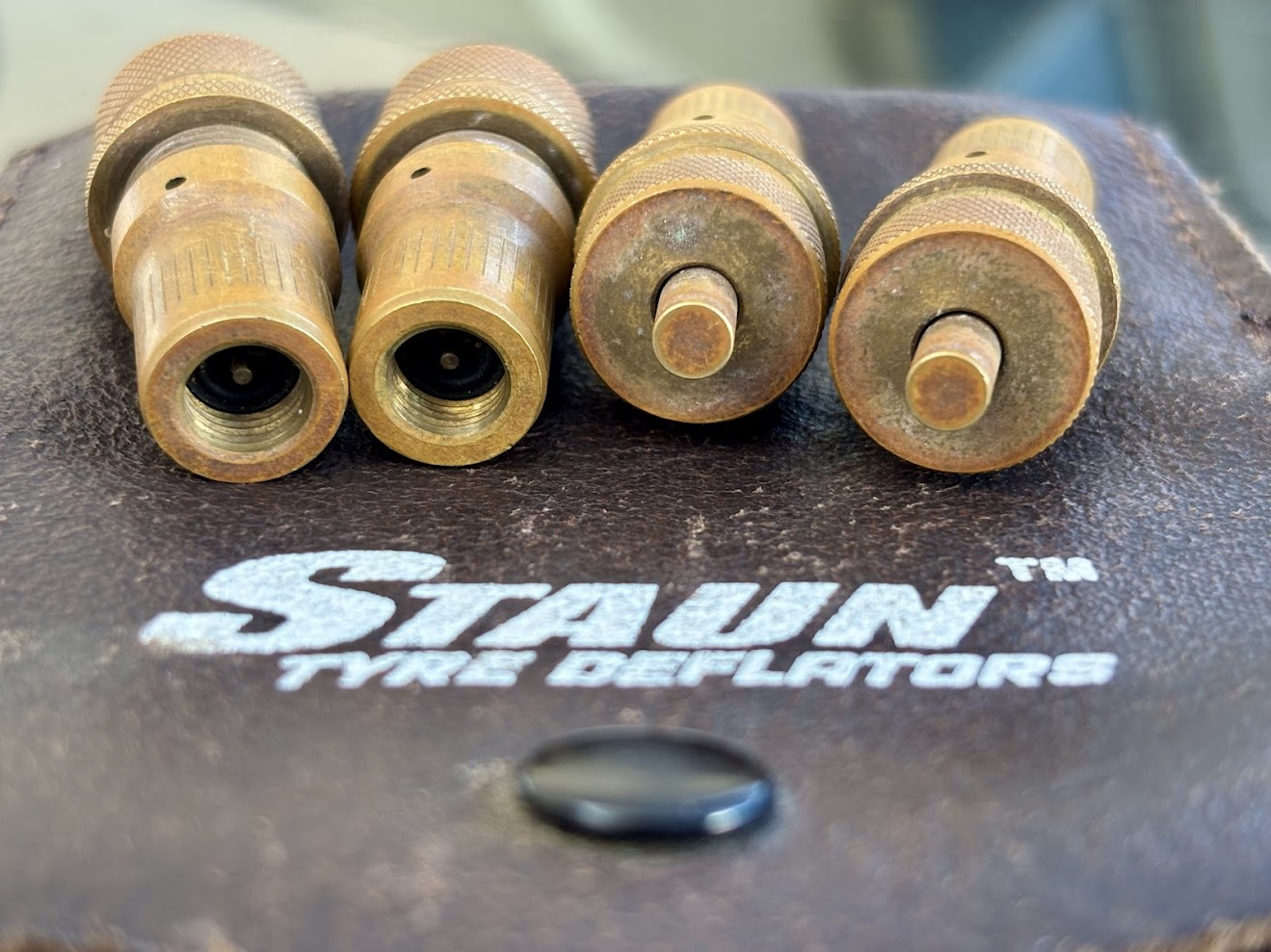Getting the 4 brass Staun Tyre Deflators out of the leather carry pouch