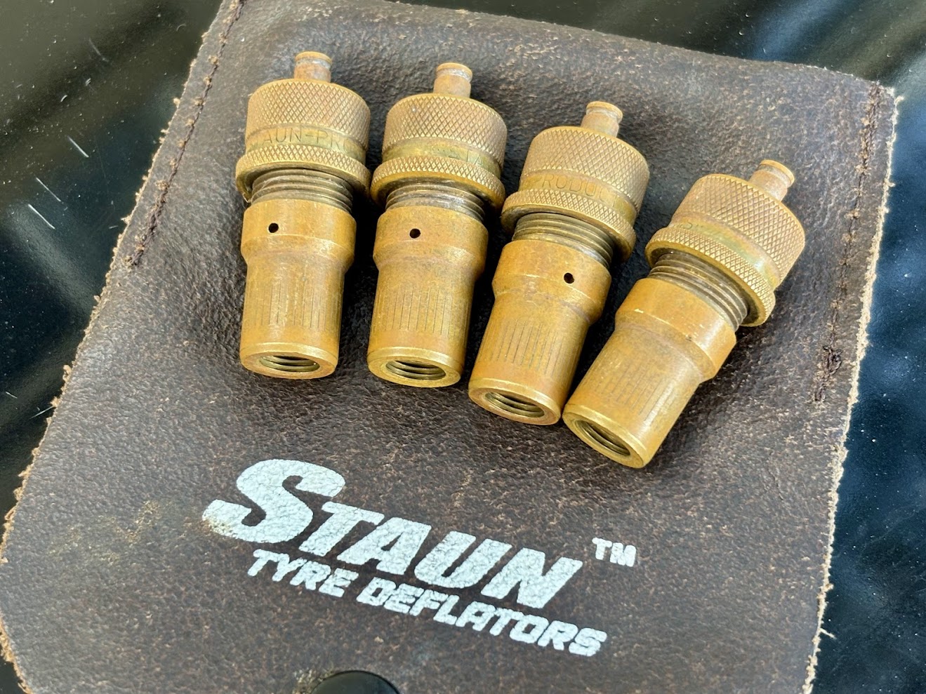 The Staun Tyre Deflators feel heavy and solid and arrive in a compact rugged leather carry pouch