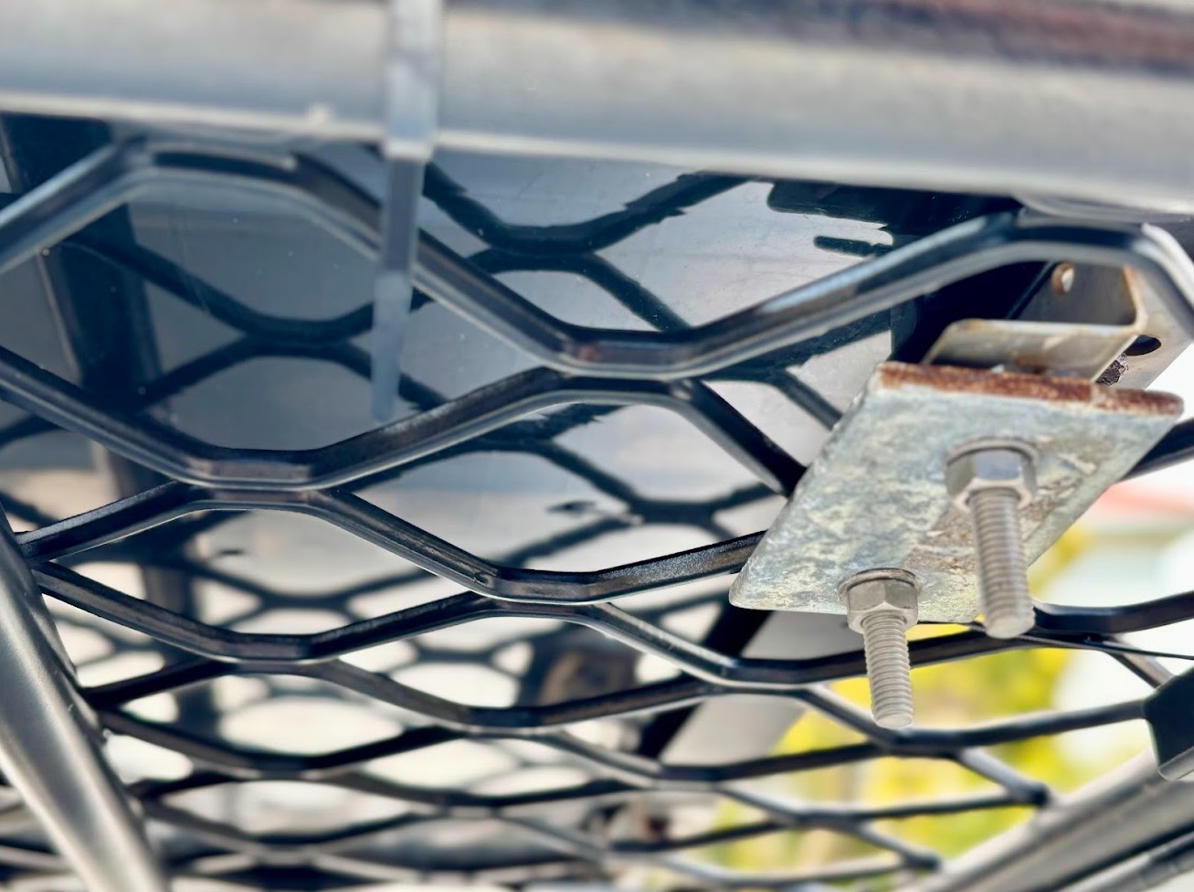 Bottom bracket fixings of Kings 100W fixed solar panel mounted on roof rack