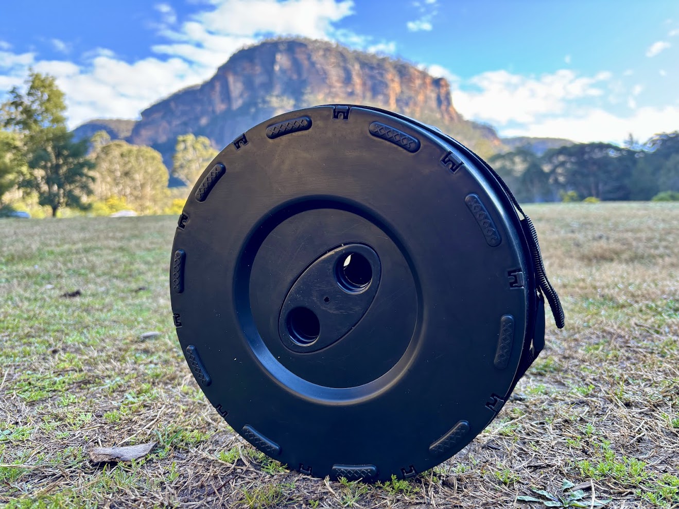 Bottom of telescopic stool in grass at campground