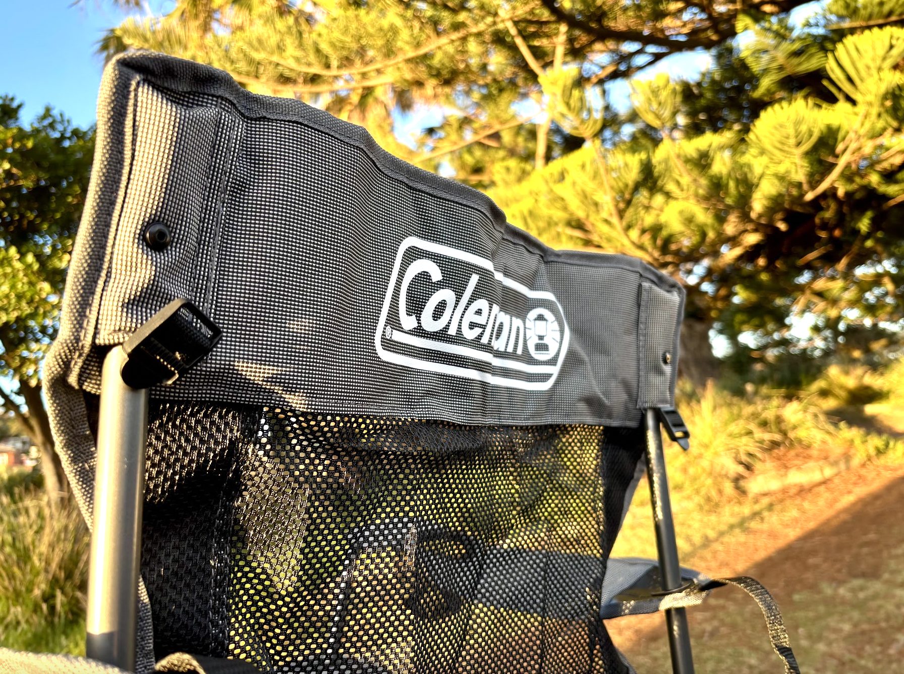 Back side with logo of Coleman mesh camping chair