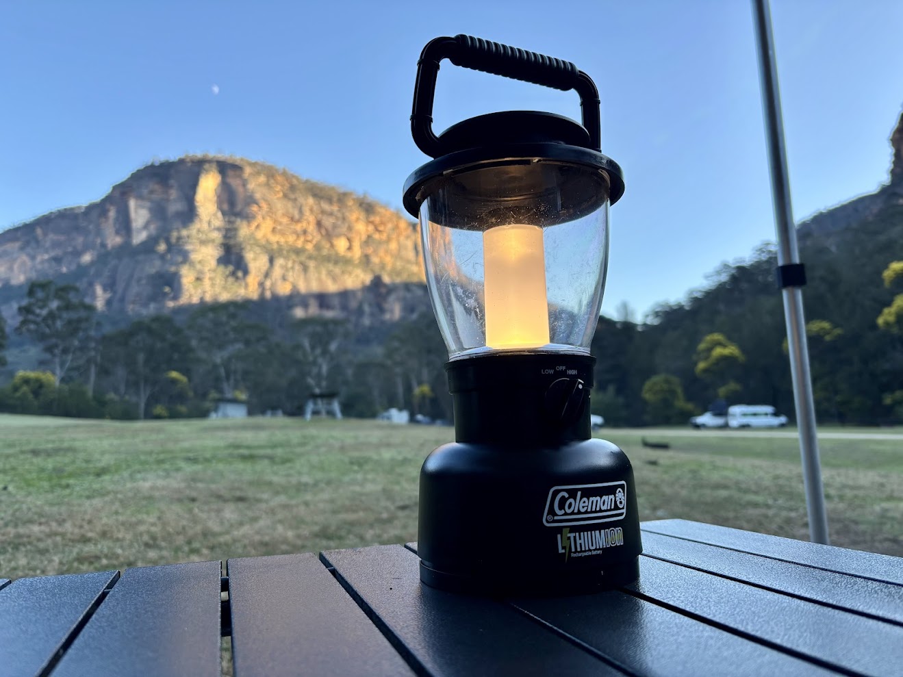 Coleman rechargeable lantern powered on at campground