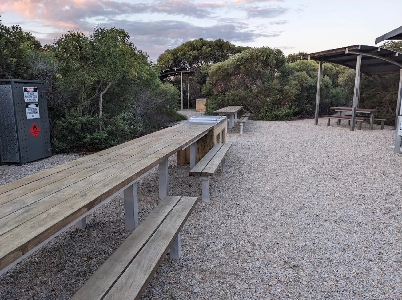 Common area with picnic tables at Four Mile Campground​
