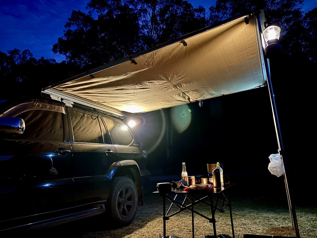 Lighting up camp under the awning with the Smiling Shark magnetic LED work light