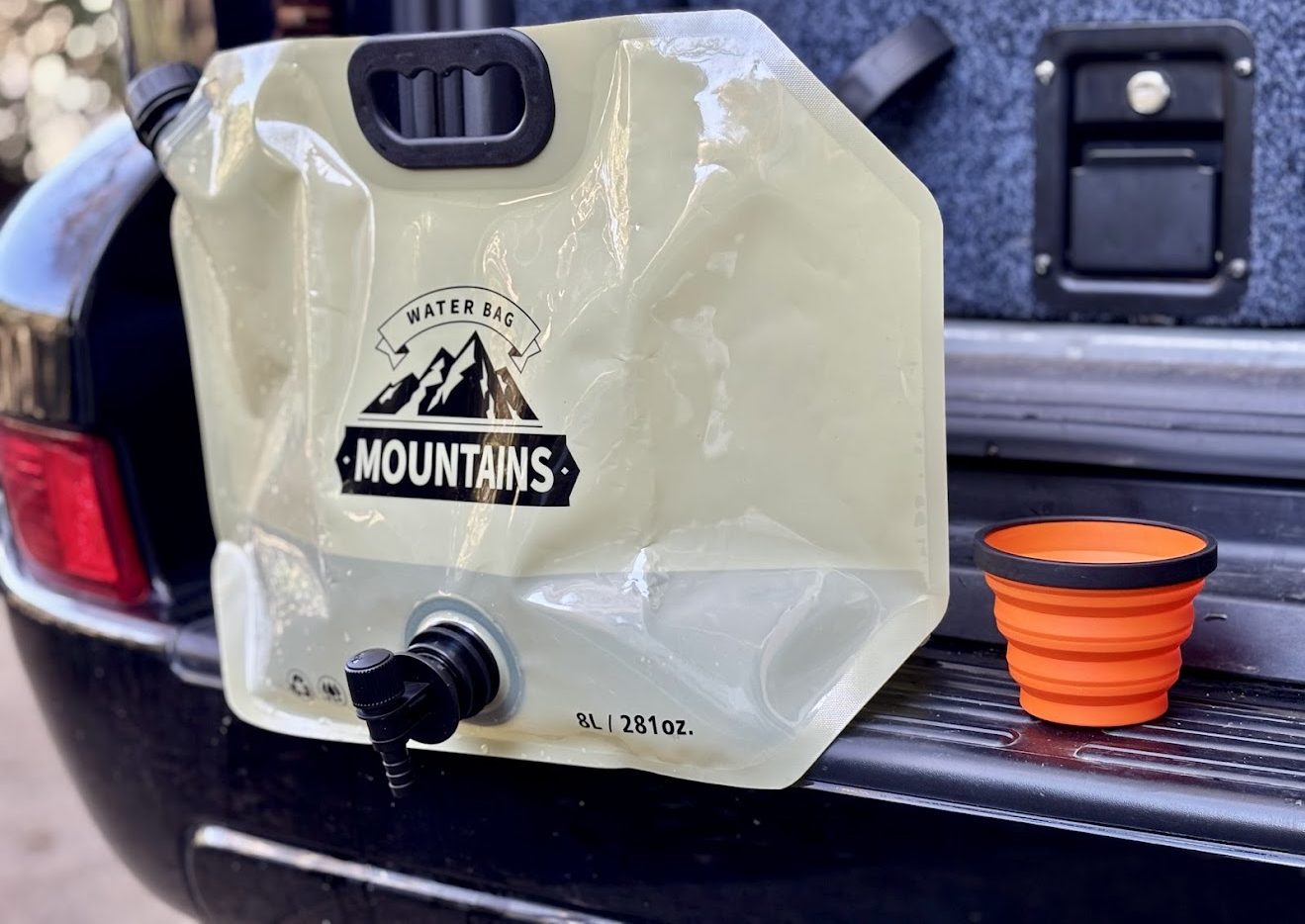 Sea to Summit X-Cup next to 8L camping water bag