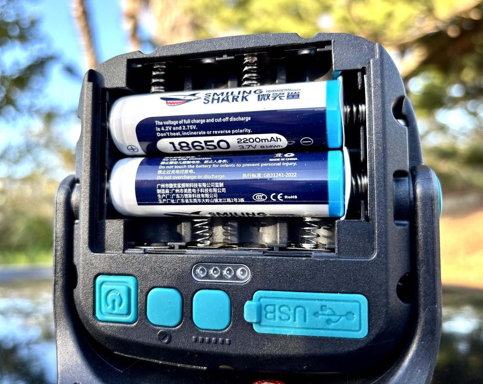 Battery insert on the back of this magnetic camping work light