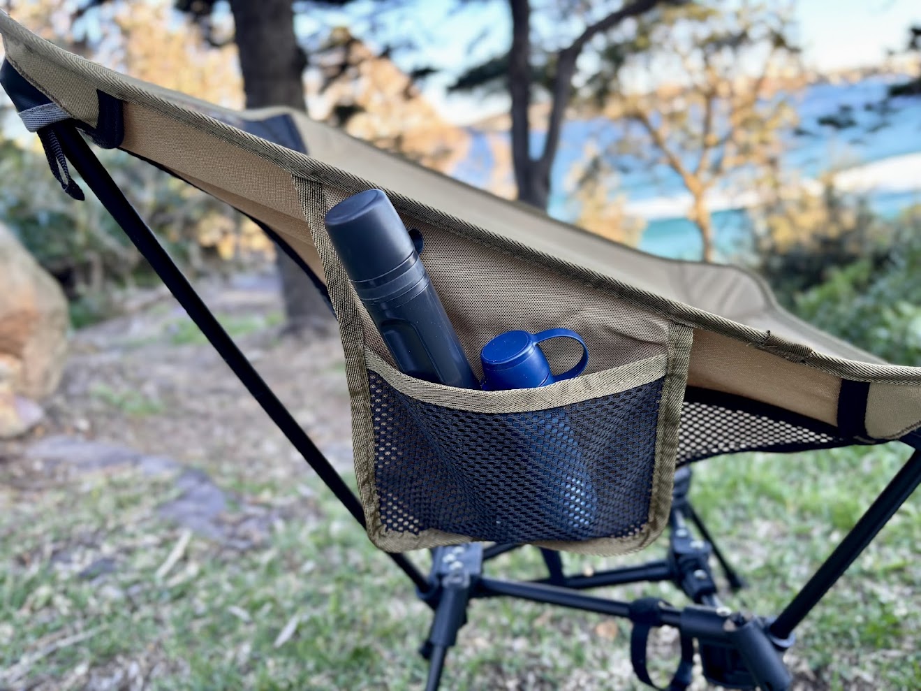 A great feature of the Moon Lence camping chair is the side pockets, which are roomy and sturdy and hold our Lifestraw water filter with ease