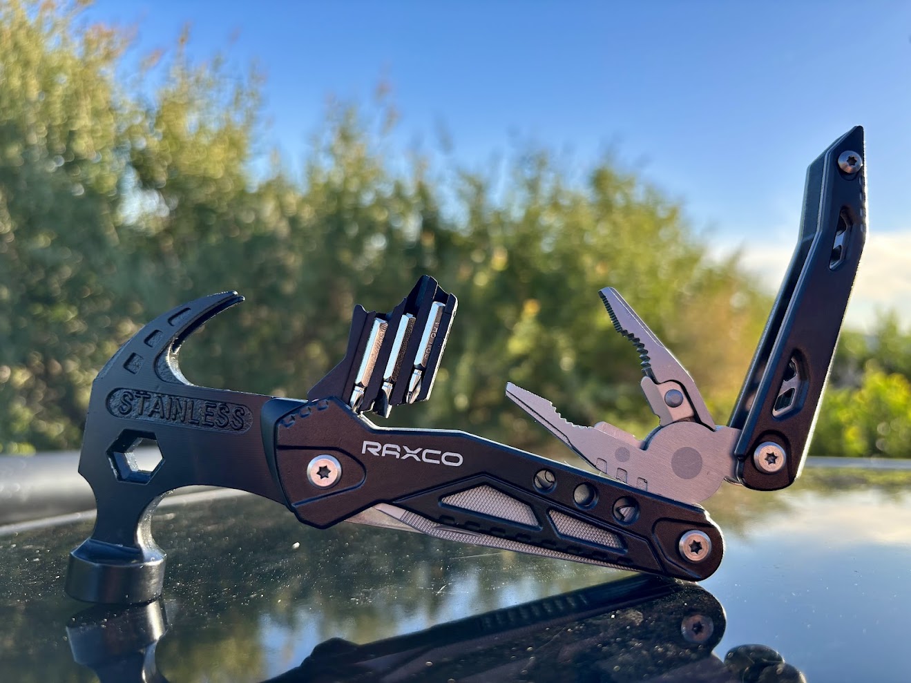 A group of 3 screwdriver bits unfolds from the centre of the Raxco multi-tool