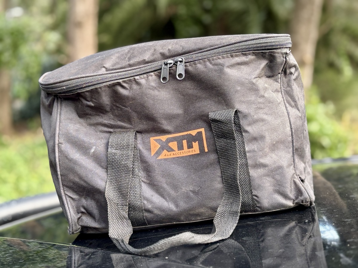 Carrying the XTM air compressor from the boot to the front of the vehicle is simple thanks to the carry case