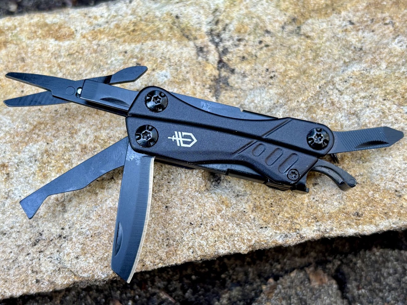 I did find some of the tools on the Gerber Dime (like the knife and scissors) a bit stiff to get out at first, but with a little use they became easier to access