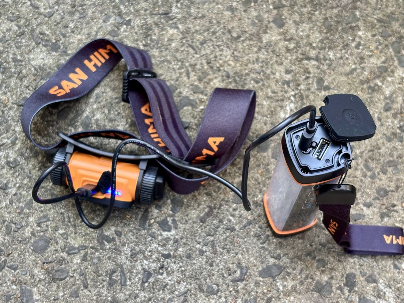 Recharging the San Hima head lamp torch using the charging funtion of the San Hima LED camp light