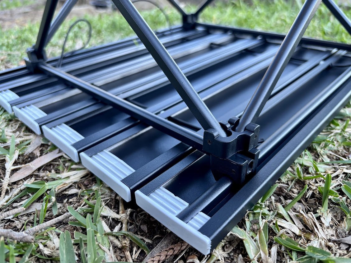 Simply unroll the tabletop of the Moonlence table, lock the legs into the tabletop frame and you're good to go