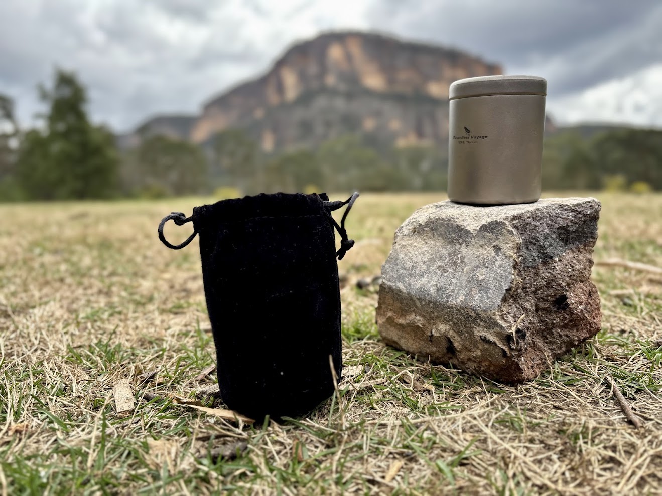 The Boundless Voyage titanium canister includes a solid black carry pouch with drawstrings