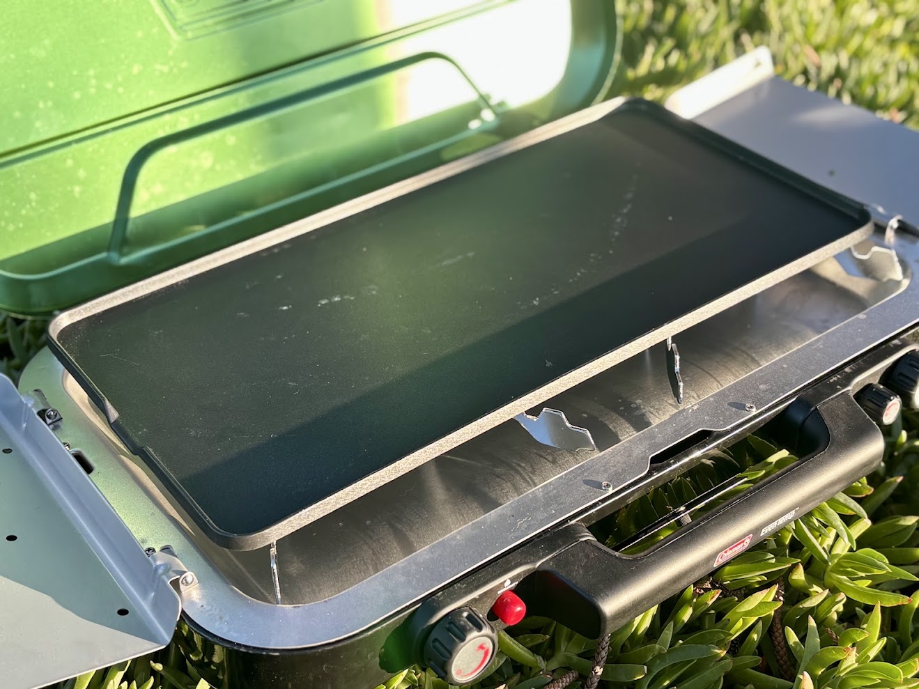 The Coleman Eventemp camping stove comes with a​ griddle to bake bacon and eggs at camp