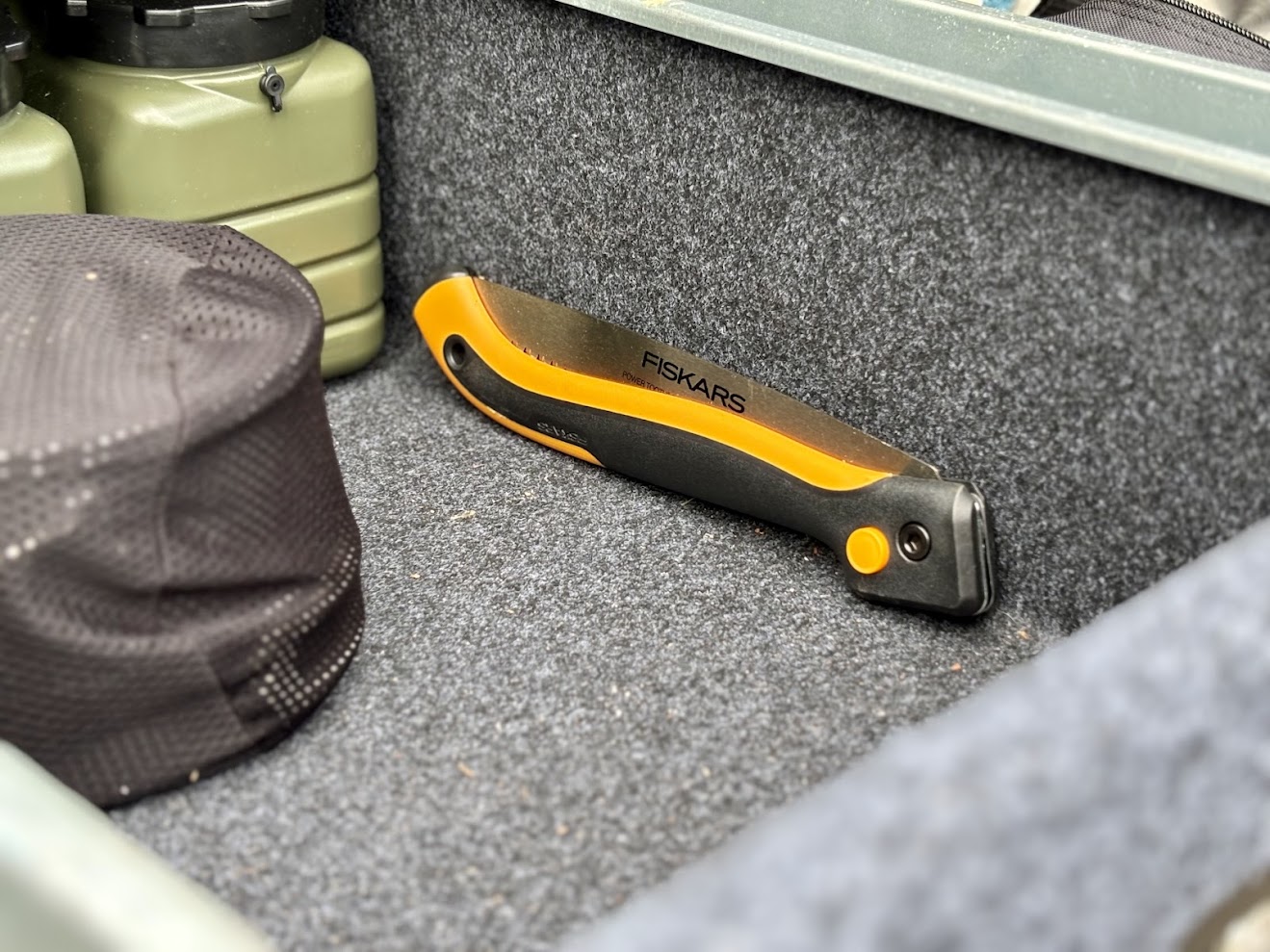 The Fiskars folding saw packed away in our Titan drawer