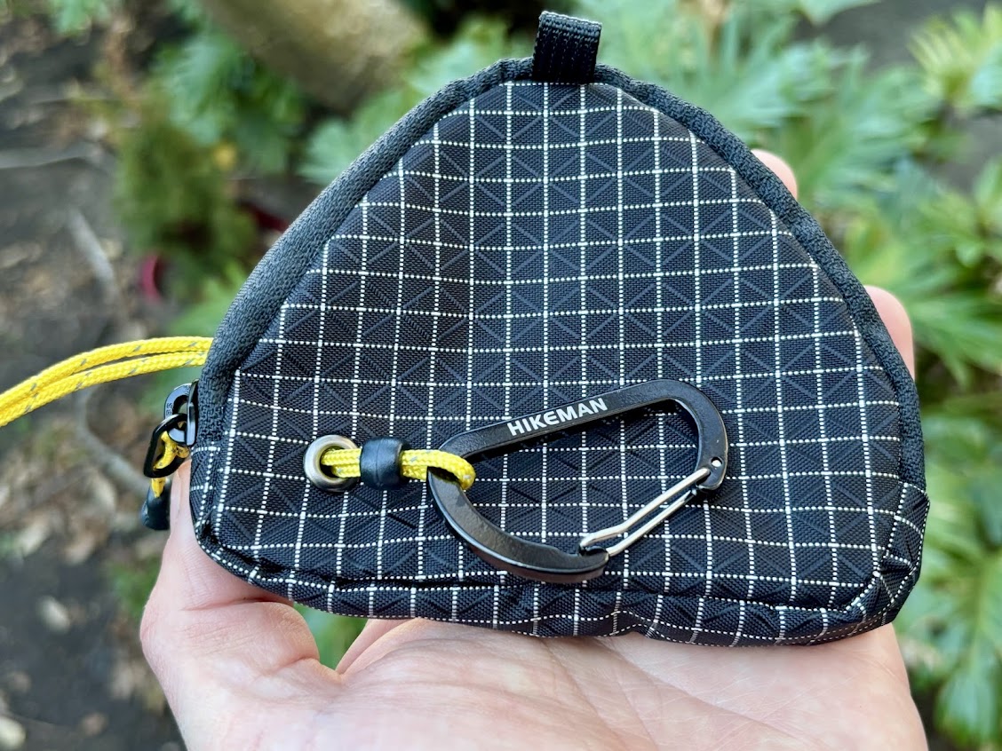 The Hikeman portable camping clothes line​ comes in a small solid black carry bag that feels very durable and has a carabiner for easy storage and setup