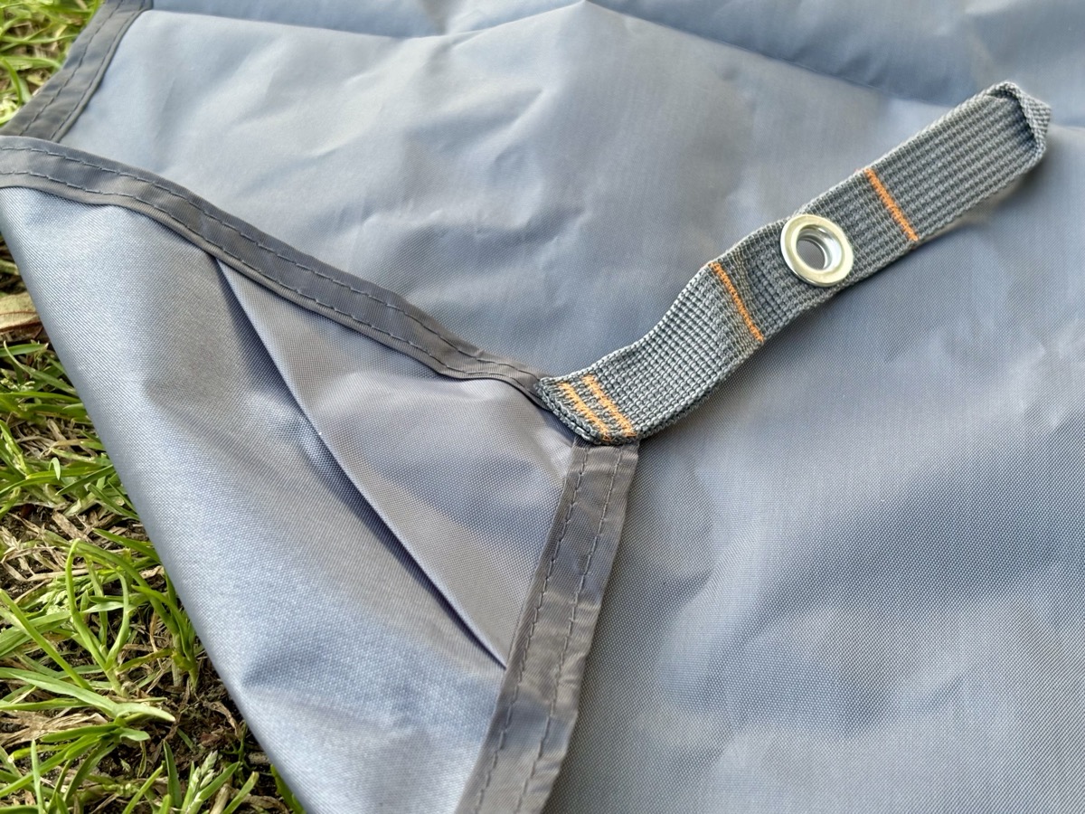 The Hikeman tarp uses 210D Oxford polyester which is a solid middle ground between ultralight nylon and heavier canvas-style tarps