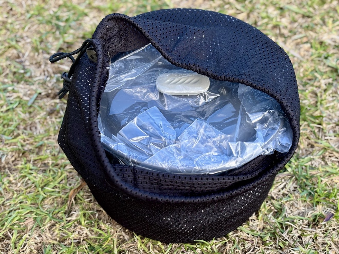 The Naturehike camping pot set is cleverly nested together and tucked inside a simple mesh drawstring bag
