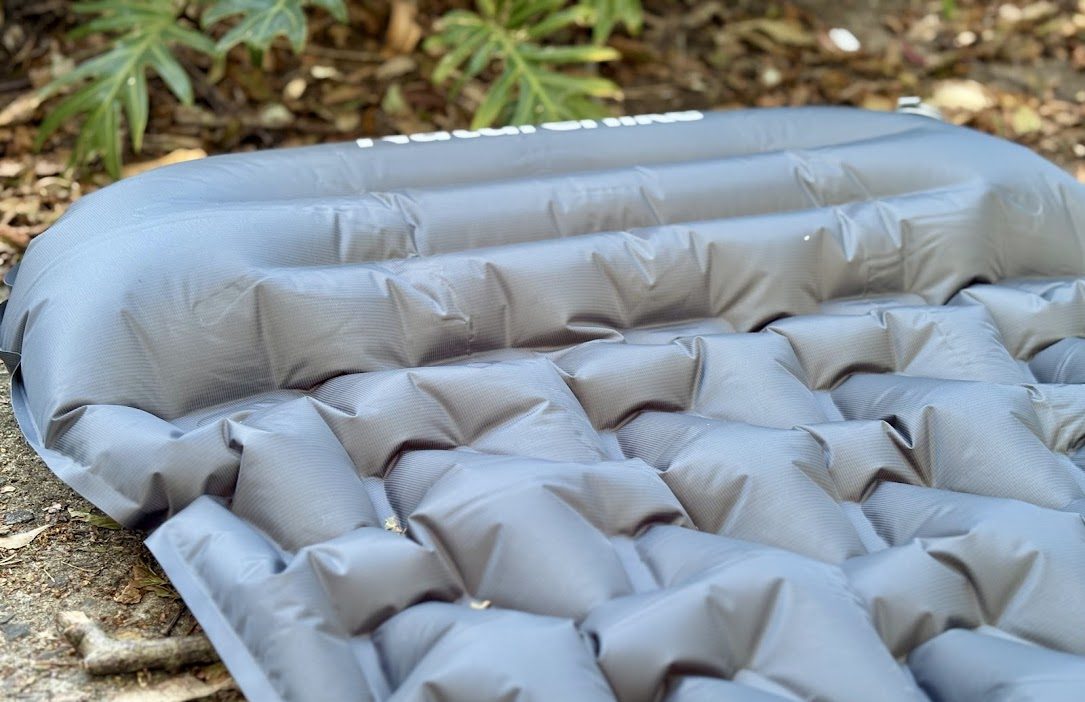 The Naturehike inflatable sleeping pad provides good head support with a thicker build-in pillow