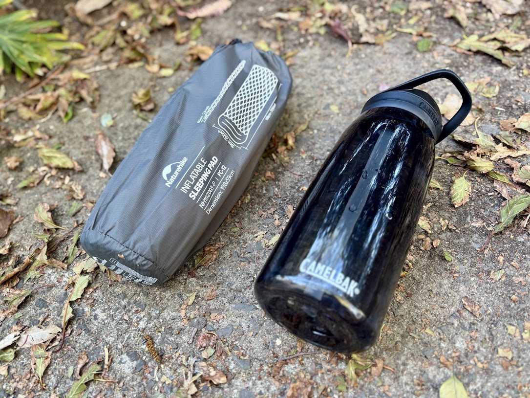 The Naturehike inflatable sleeping pad​ is barely bigger or heavier than a standard water bottle
