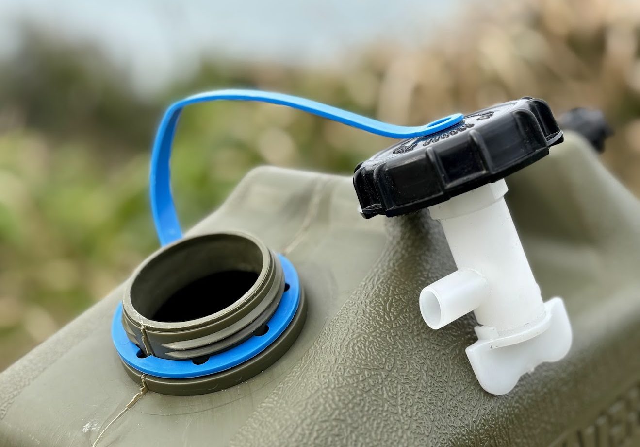 The Pro Quip water jerry can​ has a clever storage for the tap right under the lid