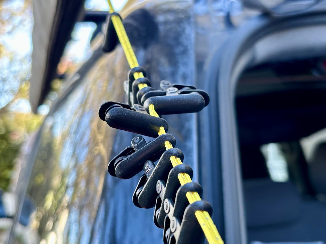 The clips on the Hikeman portable clothes line​ slide along the line, so you can space them out according to what you're hanging