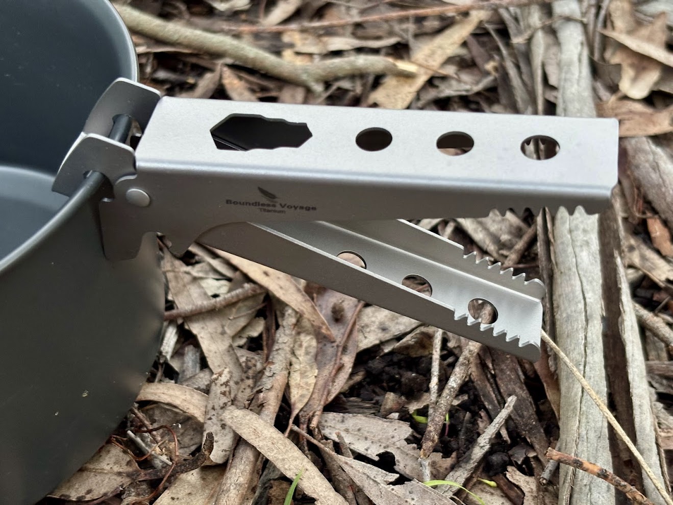 The compact titanium pot gripper from Boundless Voyage is multifuntional and also works as bottle opener, M3 wrench and food clipper
