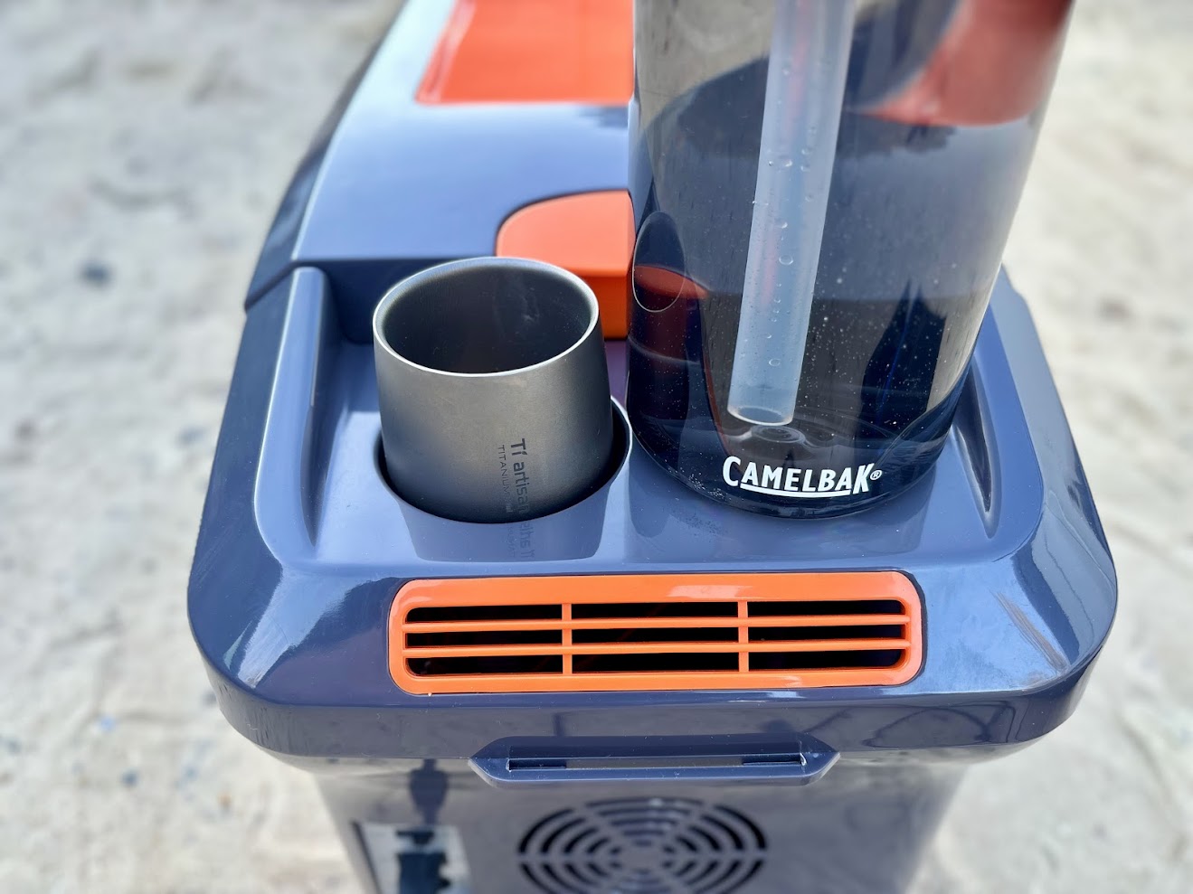 The cup holder on the XTM 12l fridge are a nice feature and fit smaller cups