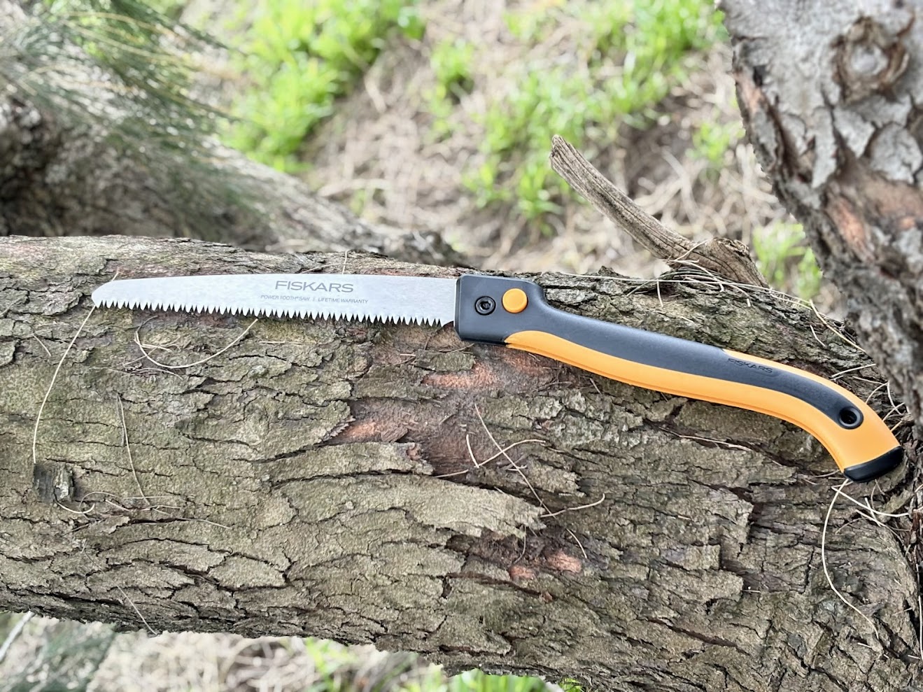 The handle of the Fiskars folding saw is contoured to fit the natural curve of your hand