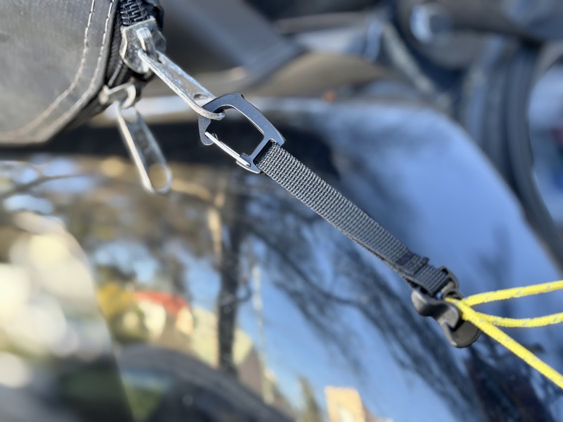 The included carabiner at the end of the Hikeman portable camping clothes line is versatile and be attached to anything like our XTM awning zipper